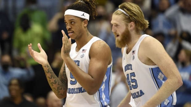 Feb 21, 2022; Chapel Hill, North Carolina, USA; North Carolina Tar Heels forward Armando Bacot (5) and forward Brady Manek (45) react in the second half at Dean E. Smith Center. Mandatory Credit: Bob Donnan-USA TODAY Sports